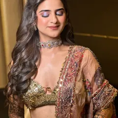A close-up of the couture Mehandi look, showing the beautiful shimmer on the eyelids and the radiant, dewy skin finish that glows from within.
