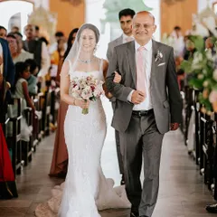 A classic moment as the father of the bride walks Priya down the church aisle. I focus on capturing the deep emotions and significance of these timeless traditions.