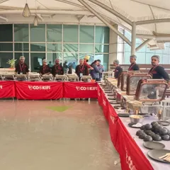 A rooftop buffet setup for a corporate party at Dell EMC. We adapt our catering services to unique venues, providing a memorable experience with a great view.