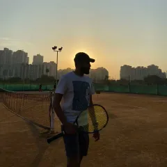 Holding my racquet on the clay court, I am always a student of the game. This dedication to my own craft directly translates into the quality of coaching I provide.