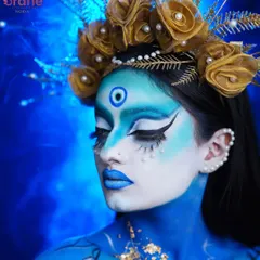 A side profile of the celestial goddess, showing the seamless blend of blue and white body paint and the delicate pearl accents.