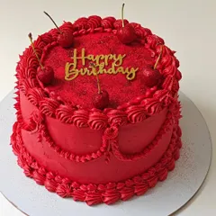 A bold and beautiful vintage-style cake in a striking red color. The intricate piping and glittery cherries make this a simple yet glamorous choice.