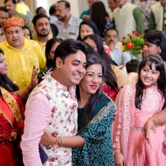 A warm hug between a brother and sister during the Mayra ceremony, surrounded by their loving family.
