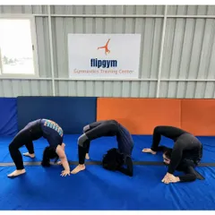 Our students work on different variations of the back bridge, from a standard bridge to a more advanced forearm bridge, to progressively increase their spinal flexibility.