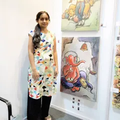 Me at my stall during the Mumbai Art Fair '22. I was so happy to exhibit my modern Ganesha painting and a piece from my Krishna series.