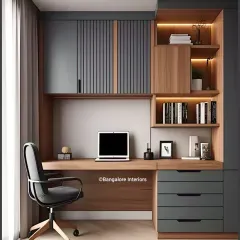 This compact home office design combines wood and dark gray fluted panels for a contemporary look. The layout includes overhead cabinets, open shelving, and drawers, providing plenty of storage in a small footprint.