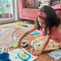 Another student deeply engaged in her Monet-inspired artwork. This technique of using wax to resist the watercolor paint creates such a magical reveal.