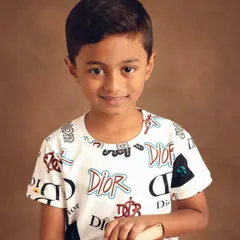 A clean portrait showcasing a different look, this time a trendy Dior-print t-shirt. This type of shot is ideal for e-commerce product listings where a clear view of the apparel is needed.