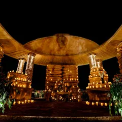 The entrance to the grotto-styled cave, enveloping guests in the warm glow of hundreds of candles. Inspired by the Ajanta and Ellora caves, this pathway offered a stunning view of the immersive world below.