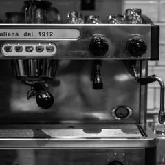 A close-up of my classic Italian coffee machine, a beautiful piece of equipment that helps me craft the perfect cup every time. It’s a testament to my commitment to authentic, quality coffee.