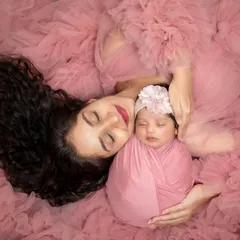 A mother's love is a masterpiece. This artistic portrait of a mother and her newborn, wrapped in matching soft pink, is one of my favorite ways to show that deep, peaceful bond. Pure and simple love.