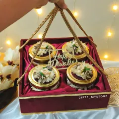 This premium velvet box with four jars of high-quality dry fruits is a client favourite. It's the perfect blend of luxury and tradition, making it an ideal corporate Diwali gift for your most valued clients and partners. The floral detailing on the lids adds a special, handcrafted touch.