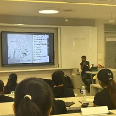 Here is a view from the classroom during a mascot design session at Dr. DY Patil University. You can see the students engaged as I walk them through the different elements of character design, from initial sketches to final details, all displayed on the main screen.
