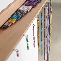 These colorful bead chains are not just beautiful, they are a cornerstone of the Montessori math curriculum. They give children a physical representation of numbers, squares, and cubes, transforming arithmetic from an abstract chore into a fascinating, hands-on exploration.