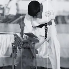 This black and white image captures the moment of impact, where focus and technique converge. Breaking is a mental exercise as much as a physical one, teaching students to overcome any challenge.