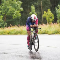 Maintaining an aero position on wet roads. This requires focus and bike handling skills. It's not just about power; it's about control.