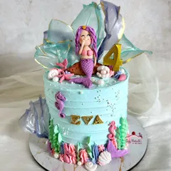 The mermaid cake on its own, featuring a hand-sculpted mermaid, rice paper sails, and lots of shimmering details.