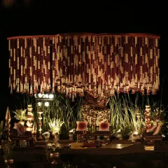 For this wedding, I brought the sacred spirit of the Banaras Ghats to life. The mandap featured a dense canopy of red and white floral strings, traditional brass bells, and an earthy, spiritual ambiance.