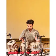 A focused moment during my solo recital at Triveni Kala Sangam. The stage is where our riyaaz (practice) comes to life.