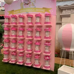 For a carousel-themed party, I designed this beautiful display wall for the party favors. Each guest got to take home their own miniature carousel, presented on custom-built shelving that was part of the overall decor.