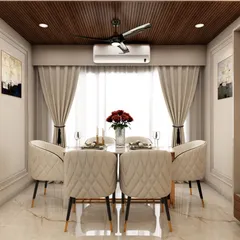 A close-up of the elegant dining area within the same open-plan space, featuring quilted chairs and a wooden ceiling panel that defines the zone while maintaining a cohesive aesthetic.