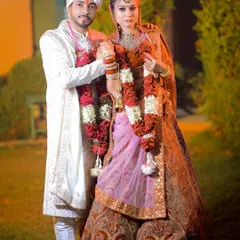 A classic wedding day portrait of the couple in their ceremony attire.