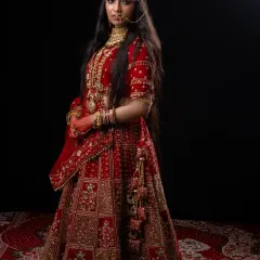 A full-length portrait of the magnificent Padmavathi costume. This rental includes the heavily embroidered red lehenga and all the traditional jewelry for an authentic royal look.