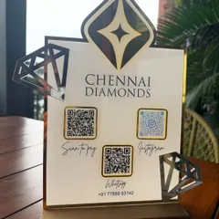 The Chennai Diamonds QR stand displayed on a wooden table, showing how it adds a touch of class to any business environment.