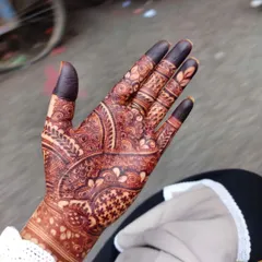 The final result. This deep, dark maroon stain is what you can expect after 48 hours. This is achieved with my special blend of organic henna and proper aftercare.