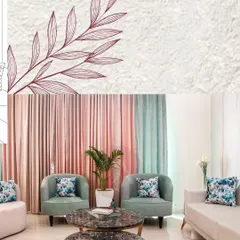 From sketch to reality. This is the finished living room, featuring pastel green armchairs and pink curtains, exactly as envisioned in the initial drawing. The floral cushions add a pop of pattern and color.