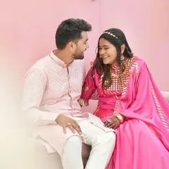 Another lovely shot of the couple. This image gives a closer look at the mirror work on the neckline and the detachable belt of the Rajputani outfit.