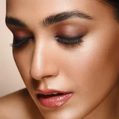 This image captures a serene moment, focusing on the subtle shimmer of the eyeshadow and the smooth texture of the skin. It demonstrates my ability to create gentle and elegant beauty portraits.