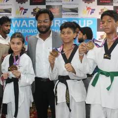 Students posing with their medals at the Warriors Cup. Each medal represents a personal victory and a step forward in their competitive journey.