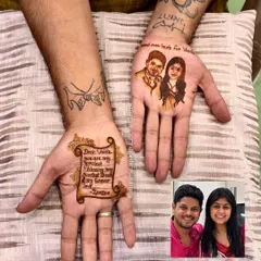 Mehandi isn't just for brides. This groom chose to express his love with a beautiful portrait of his bride on one hand and a heartfelt letter written in henna on the other, a truly personal touch.