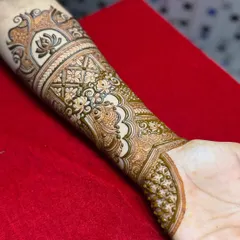 The design is now complete, showing the full arm band with intricate details. This step-by-step series shows how a complex design is built layer by layer.