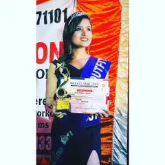Holding my trophy and certificate after winning the "Miss. Outfit" award. Success comes from working hard in silence and letting the results speak for themselves.