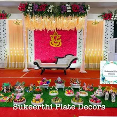 A puberty ceremony plate arrangement at Rengaz Mahal, Kaniyur. The display is centered around a Ganesha motif on the backdrop, with my plates complementing the theme.
