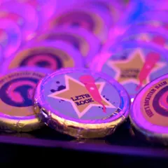 Custom-printed "Let's Rock" chocolates for a rockstar-themed birthday party. These small details make great party favors and reinforce the theme.