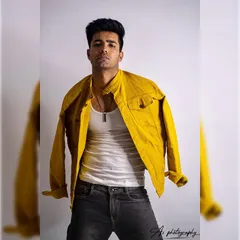 A dynamic studio shot with the jacket appearing to float. This creative pose adds energy and movement to a standard studio portrait.