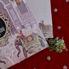 A detail shot of the elephant procession illustration from the regal pink invitation suite.
