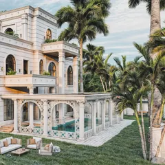 This view reveals the rear of the classical estate, focusing on the colonnaded pool enclosure and outdoor lounge area. The rendering captures the intricate tile work and the reflection on the water, conveying a sense of private luxury.