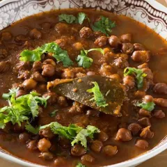 A comforting bowl of my Black Channa Curry. It's slow-cooked with aromatic spices like bay leaf and garnished with fresh cilantro. This dish is packed with protein and flavor.