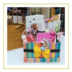 A vibrant and colorful birthday hamper for a best friend. This box is filled with a dreamcatcher, a personalized photo frame, and other cute goodies.