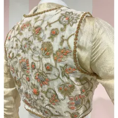 The back view of our double-layered ensemble, showcasing the intricate jari thread embroidered velvet jacket with hints of coral detailing.
