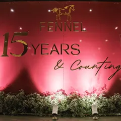 A custom backdrop designed for the Fennel Living 15th anniversary. The elegant gold lettering on a rich pink background, accented with baby's breath, created a sophisticated and celebratory focal point.