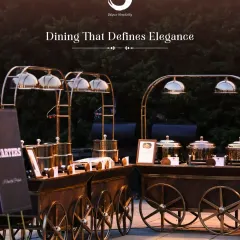We provide dining that defines elegance. This image showcases our unique, cart-style buffet starters station, combining sophisticated presentation with gourmet food for a memorable catering experience.