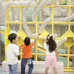 Children are fascinated by our air-tube wall, where they can send scarves flying through a maze of transparent tubes.