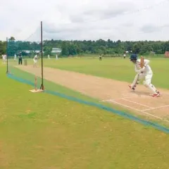 An open net session on a turf wicket. This is far better than practicing on matting, as it prepares you for the variable bounce and spin of a real match pitch.