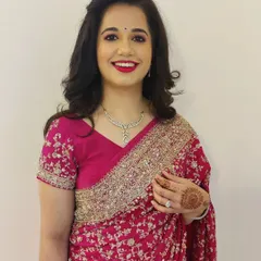 A classic look that never fails. Here, I've styled my client with beautiful, bouncy curls and a timeless red lip for a party. This look is all about elegance and confidence.