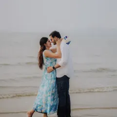 An almost-kiss by the shoreline. This romantic photo captures the anticipation and love between Jayashree and Anand during their beach pre-wedding session.